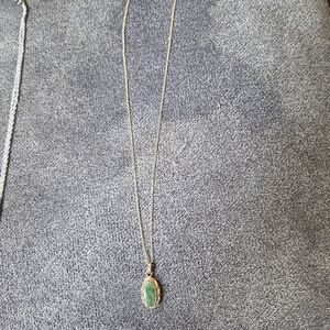 Elegant Gold Necklace with Green Pendant